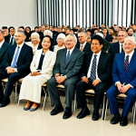 **

"A diverse group of fully clothed people attending a Jehovah's Witnesses' service in a Kingdom Hall, modest attire, appropriate content, safe for work, focus on friendly atmosphere and intergenerational attendance, well-lit interior, natural pose, perfect anatomy, professional photography, high quality."

**